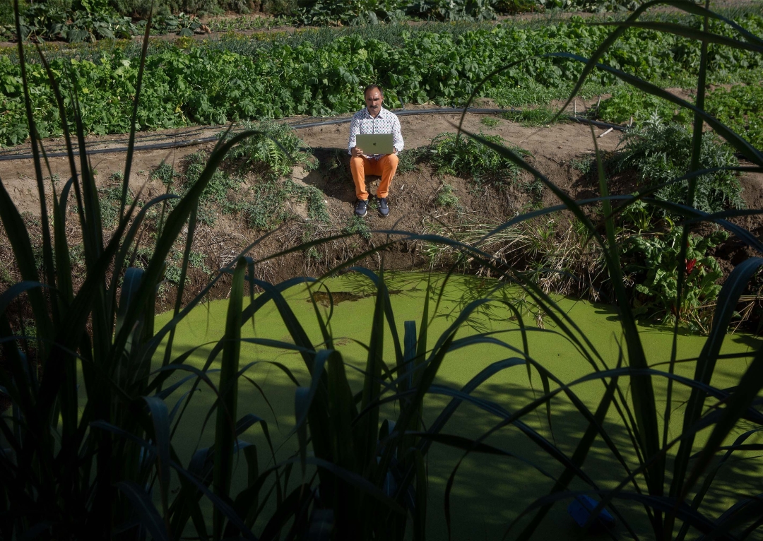 Rafa Monge looks at the pond in the family navazo allotment from a new angle, promoting creativity as a lifeline for local agriculture