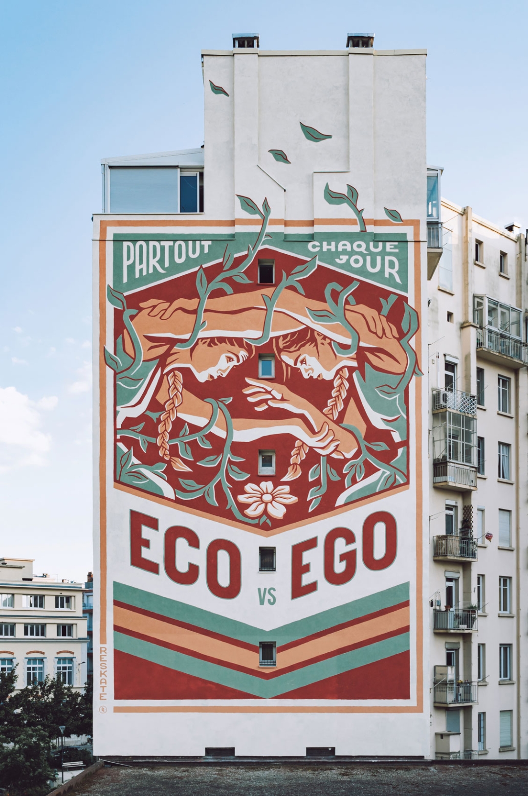 A mural with a retro poster aesthetic created by Reskate Studio in Grenoble (France)