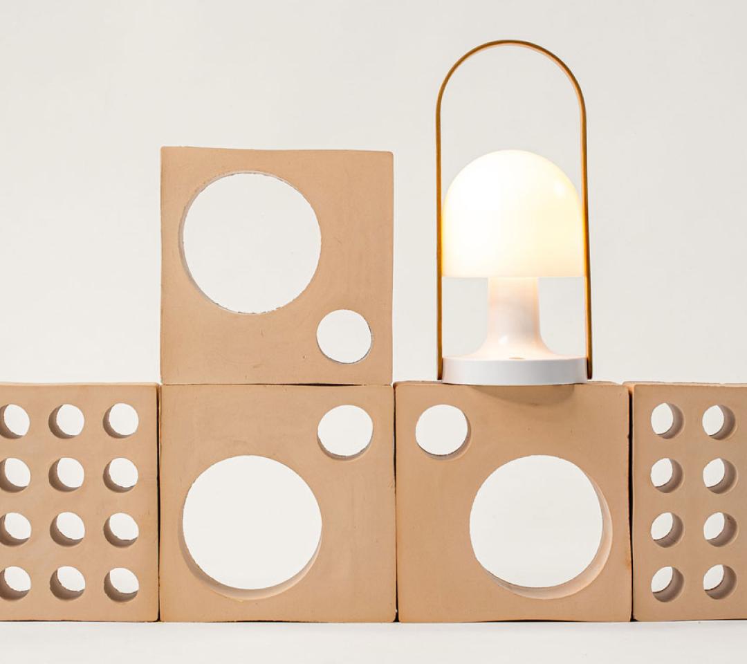 Designer Inma Bermúdez poses with her ‘FollowMe’ lamp, one of her most iconic creations